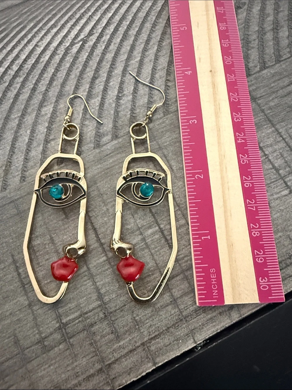 Gold Face Outline Drop Earrings with Blue and Red Accents